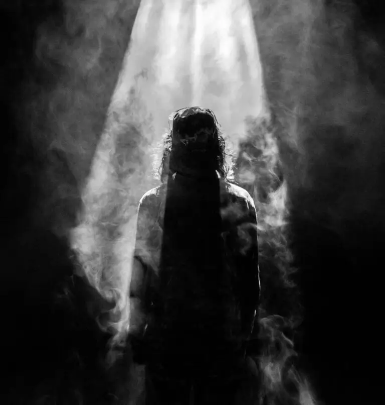 black and white image of christ wearing a crown of thorns and ascending