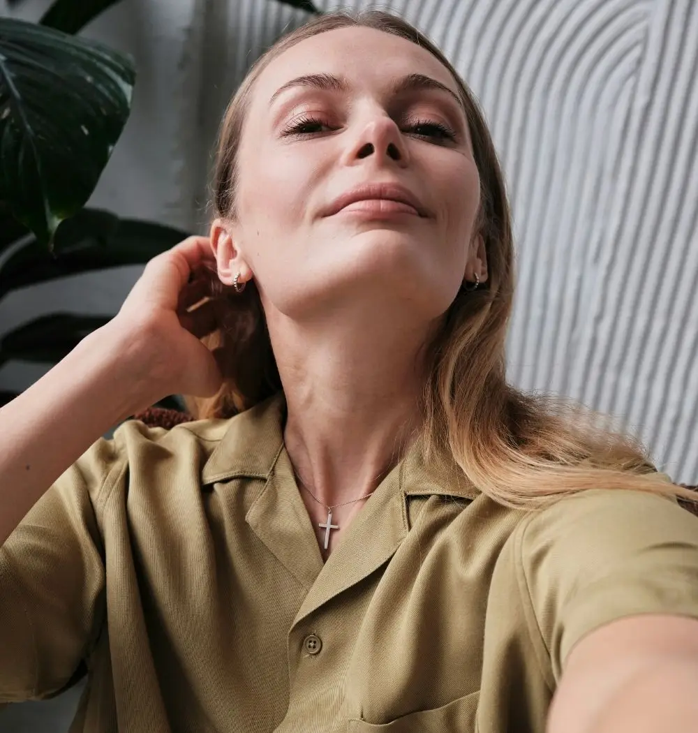 empower-your-spirit-bible verses young blonde woman confident selfies with cross necklace