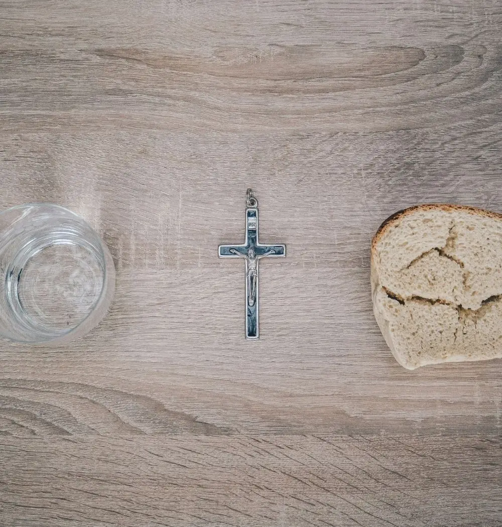 misconceptions of christian fasting with image of cross in between water and stale bread