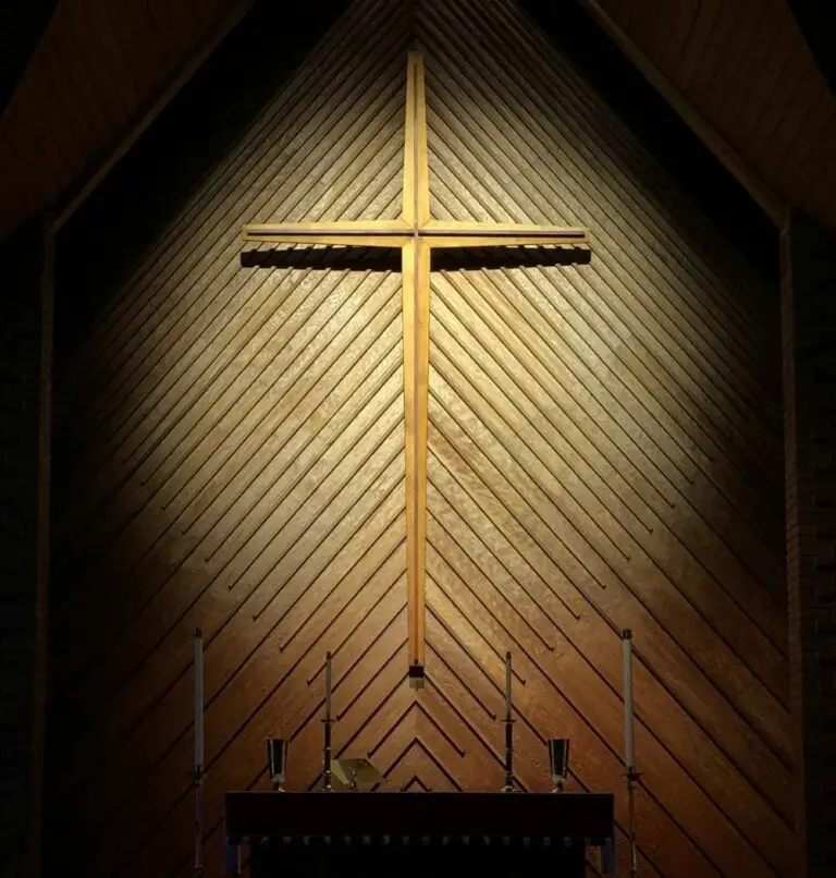 lent showcased with a gold cross with spotlight