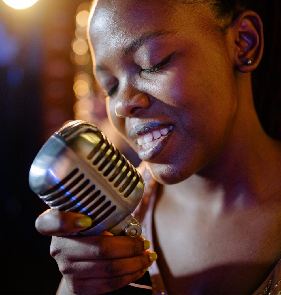 Female gospel singer with old-fashioned microphone