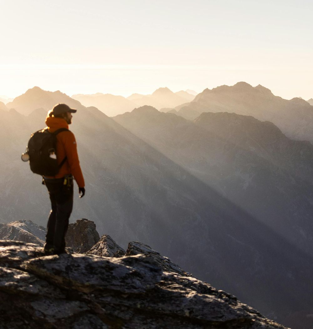 Christian man hiking in mountains on spiritual journey