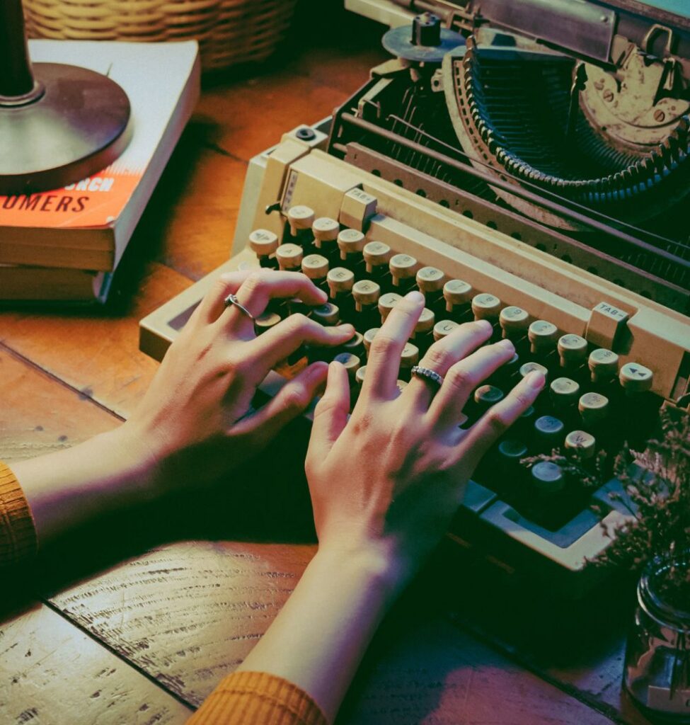 Christian mystery writer typing on typewriter