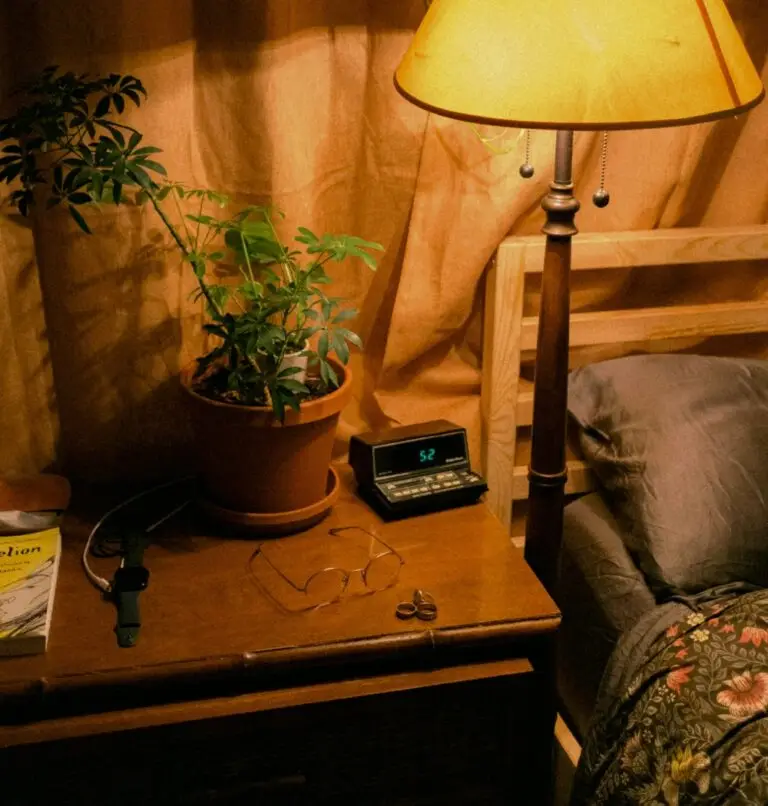 Nightstand, bed and lamp before bedtime prayers
