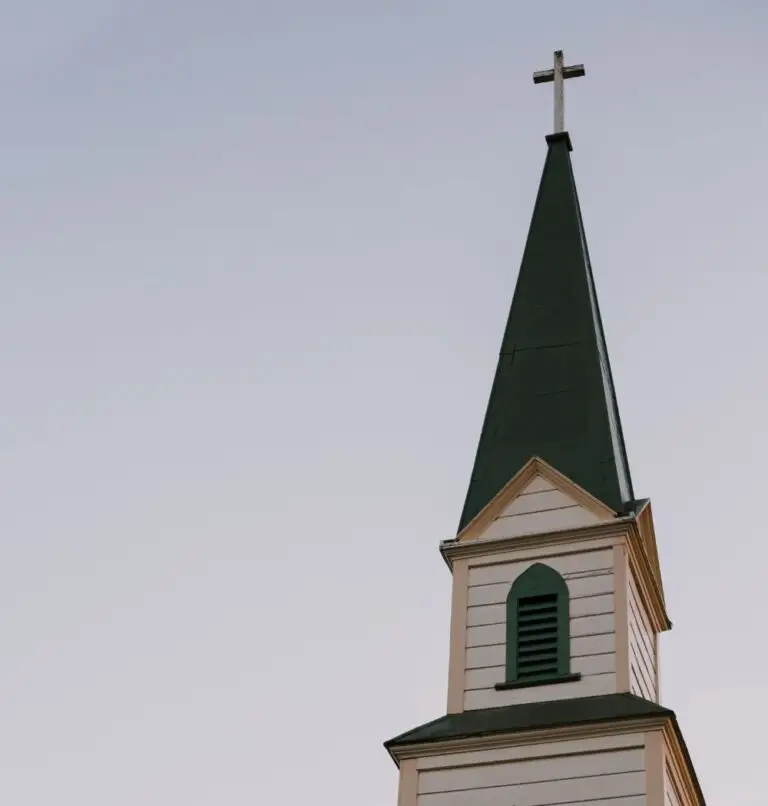 Green and white church steeple in home town